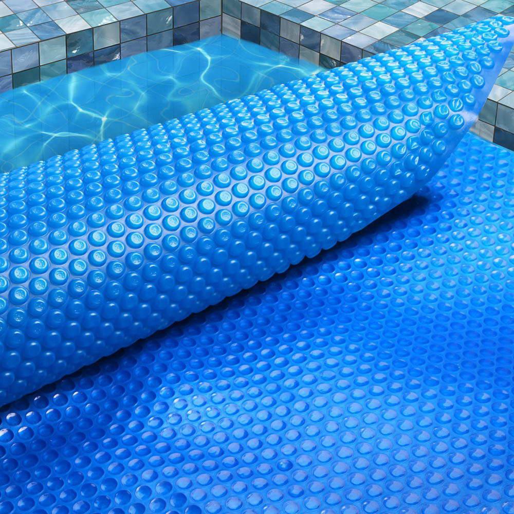 Aquabuddy 8M x 4.2M Solar Swimming Pool Cover made of durable 400 Micron polyethylene, designed to retain heat and reduce evaporation.